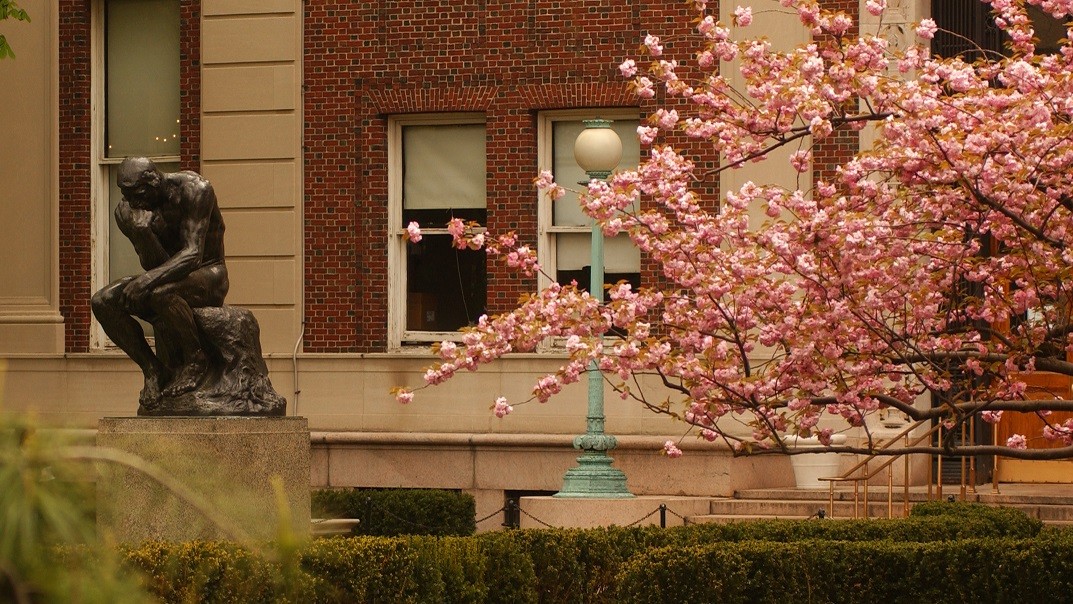 Thinker statue in spring on Morningside campus