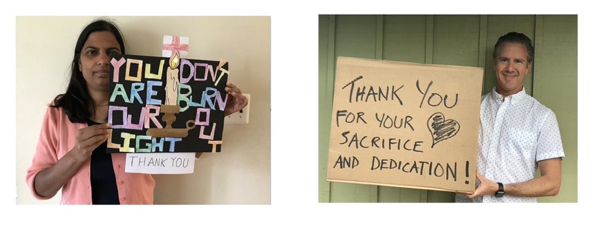 CUIT Employees holding thank you signs